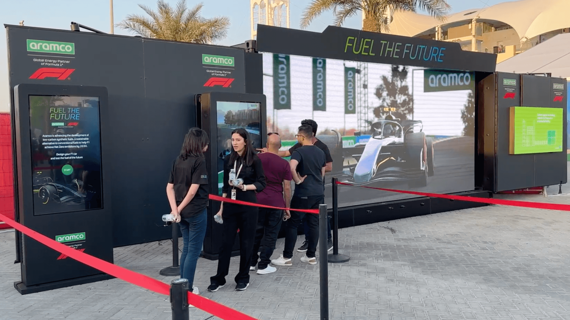 Aramco F1 Fanzone livery configurator on a large touchscreen at a grand prix fanzone